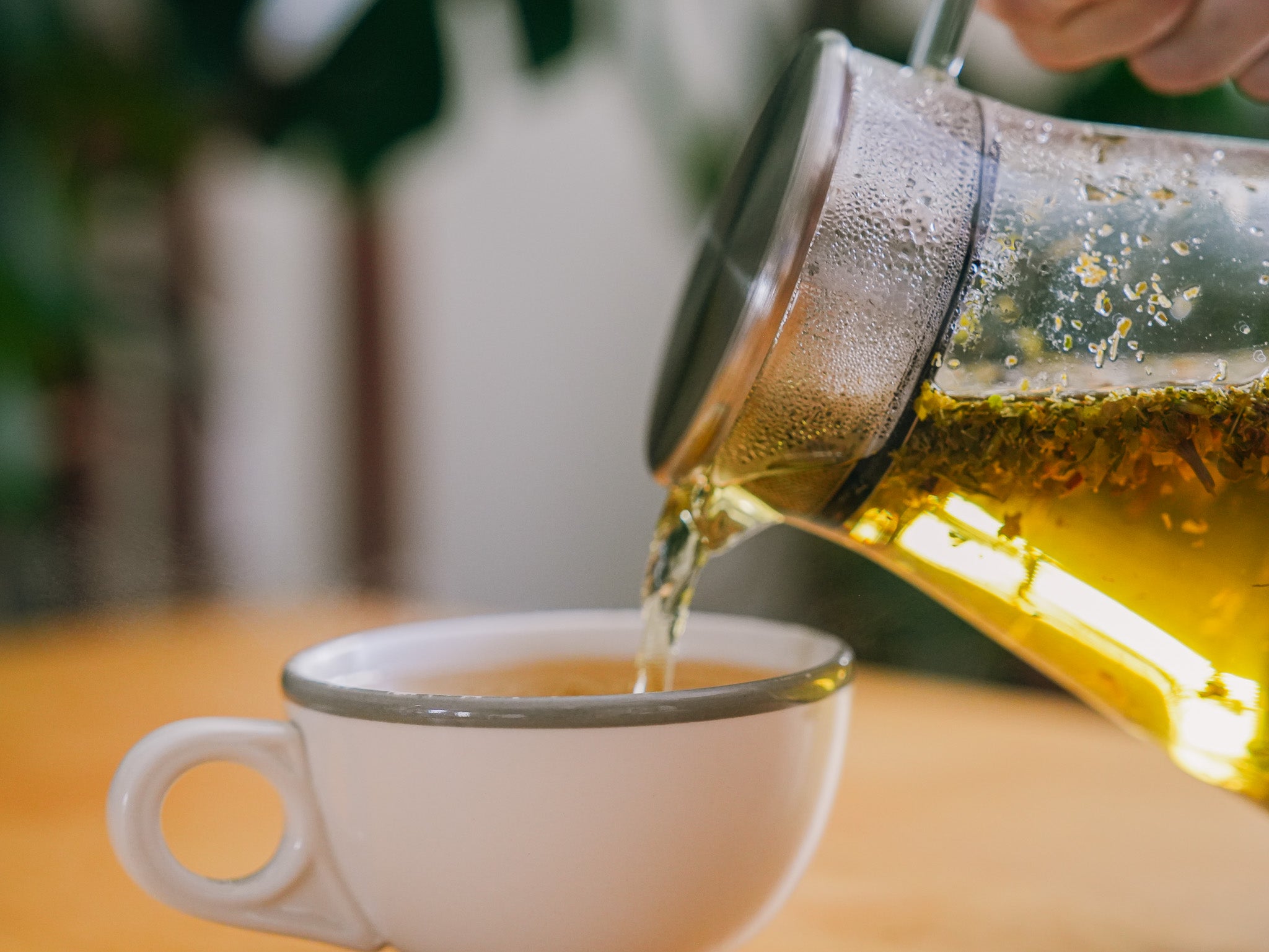 Tea poured from glass carafe